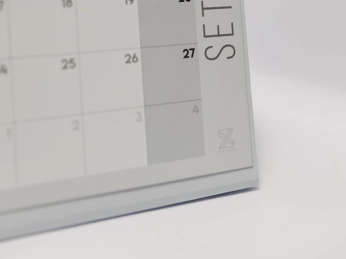 Parent reviewing a shared family calendar at home
