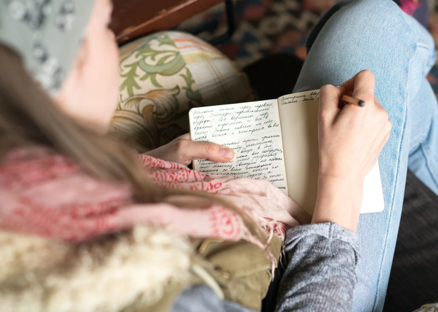 Woman planning the week in a bright city apartment